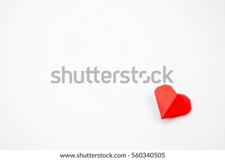 Red heart paper on white background.
