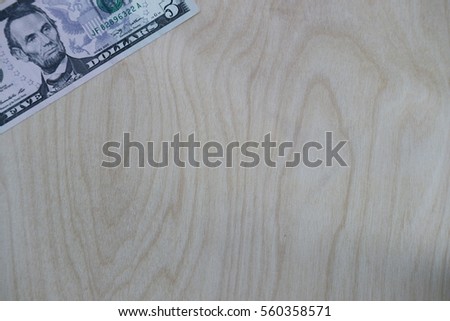 US dollar cash, banknote on wooden background