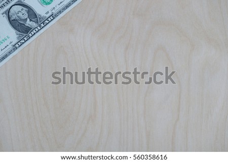 US dollar cash, banknote on wooden background