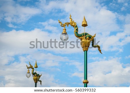 king of snake lamppost with cloud sky in Thailand, Asia.