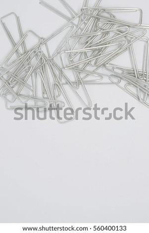 silver paper clip isolated on white background