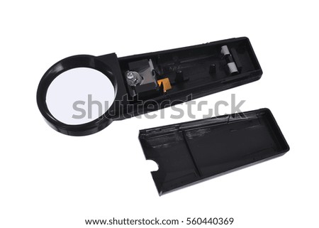 Magnifying glass with illumination. Hand magnifier for reading on a white background.