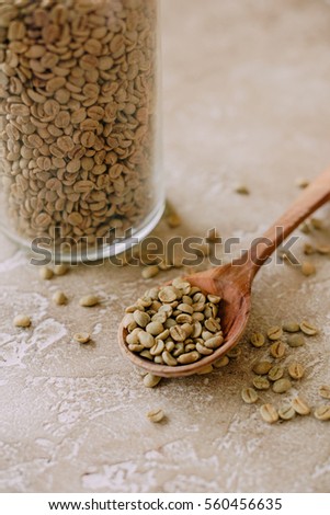 grains green coffee with spoon