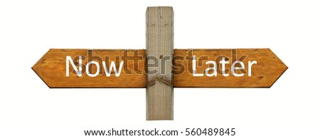 A sign with posts going left &right with 'Now' in one direction and 'Later' in the opposite , a concept sign for making a decision tr do something now or delay a decision until a more appropriate time