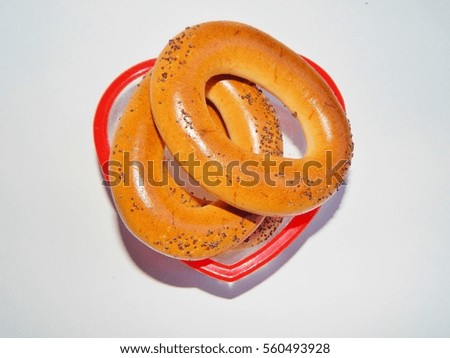 Bagel with poppy seeds on a white background