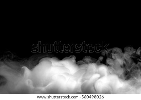 Abstract fog or smoke move on black color background Royalty-Free Stock Photo #560498026