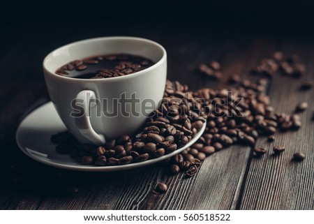 mug with coffee beans saucer