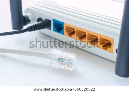 internet cable and a router on a white background