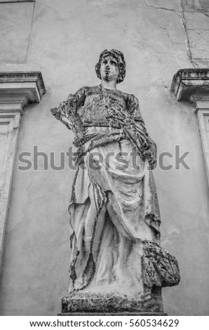 ancient statue in black and white marble background