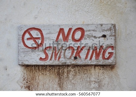 Old wooden no smoking sign