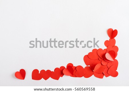 Corner made of paper hearts, on white background, Valentines day concept.  Copy space.