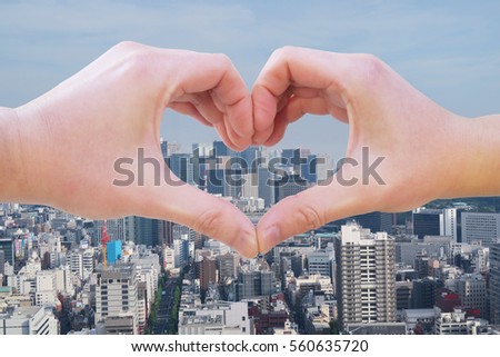 hand sign heart city background