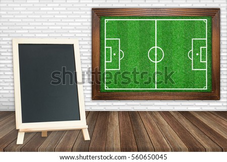 grass soccer field with blackboard on floors 
