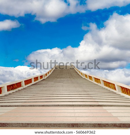 concrete staircase going up into a blue sky