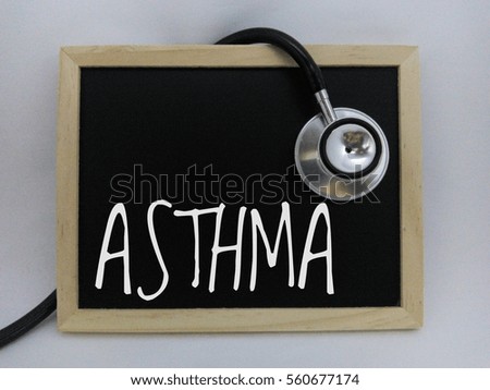 Stethoscope and Chalk board with inscription asthma isolated on white background. Medical concept

