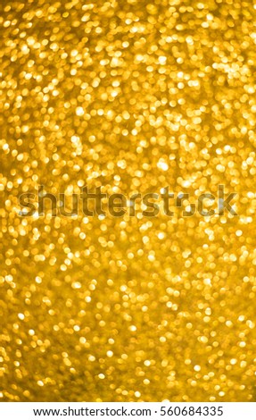 gold abstract background with bokeh defocused lights.