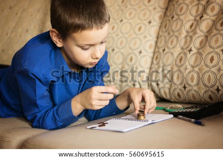 the boy is studying Finance Royalty-Free Stock Photo #560695615