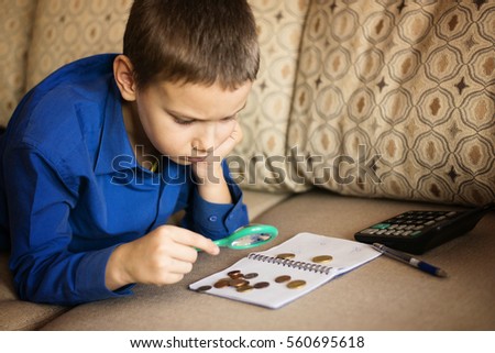 the boy is studying Finance Royalty-Free Stock Photo #560695618