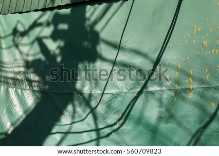 Bright green canvas backlight awning canopy umbrella scenes from beach town village fishing kelong floating sea side community shophouses along streets of South East Asia city Indonesia Malaysia
