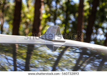 GPS antenna shark fin shape on a roof of car for radio navigation system, outdoor car radio antenna