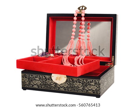 Picture of the opened jewel-box with red fit-out. Wooden jewel-box with pink coral bead necklace isolated on white background. Side view.