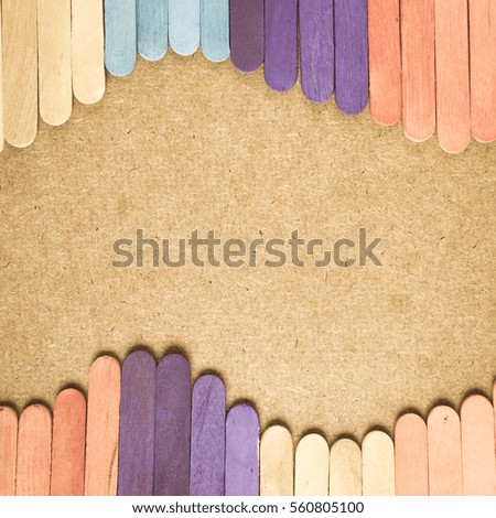 Aged color of ice cream sticks and the brown background