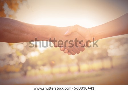 Business partnership meeting concept. Image handshake. Successful businessmen handshaking after good deal. Horizontal, blurred background. Royalty-Free Stock Photo #560830441