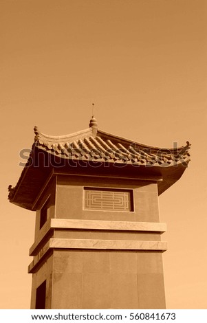 Chinese architectural style tower under blue sky, closeup of photo
