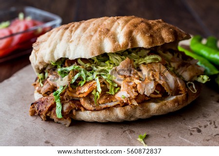 Turkish Chicken Doner Sandwich with pide. (fast food concept) Royalty-Free Stock Photo #560872837