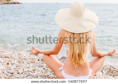 Woman with beautiful body at tropical beach.