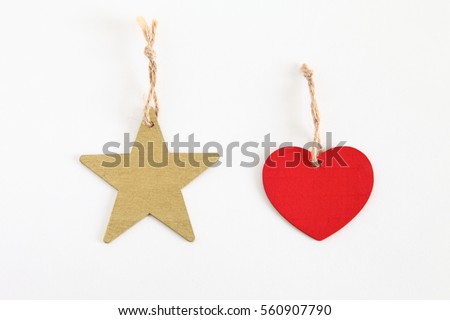 Red wooden heart shaped tag & star shaped tag with rope isolated on white