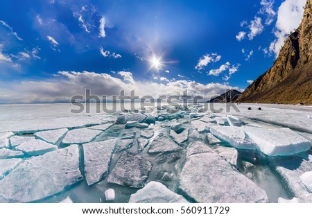Wide panorama of Lake Baikal ice hummocks in Olkhon Island. Royalty-Free Stock Photo #560911729