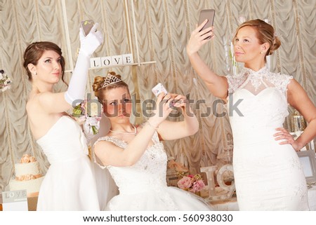 brides taking selfie and making funny grimaces