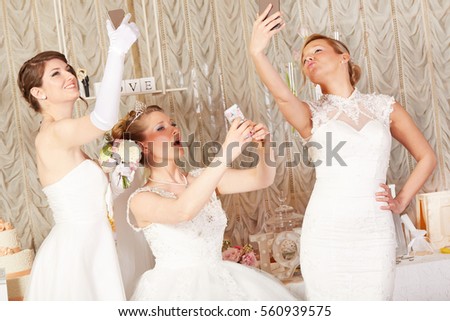 brides taking selfie and making funny grimaces