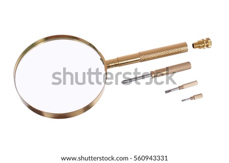 Golden magnifying lens with built-in set of screwdrivers. A magnifying glass on a white background.