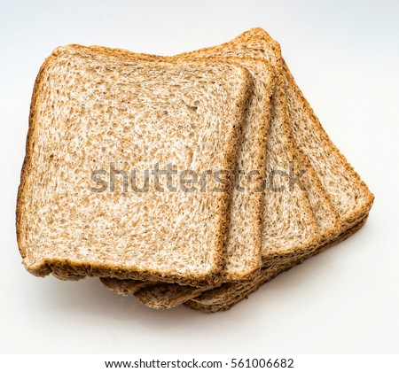 Sliced  bread to toast isolated on white background. Close up. Top view Royalty-Free Stock Photo #561006682