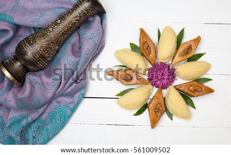 Flower made from national Azerbaijani Nowruz. Novruz sweets pakhlava and shekerbura 
