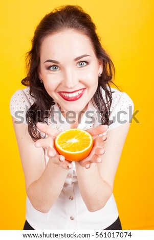 girl shows orange yellow