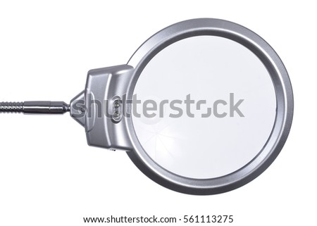 Desktop a magnifying glass for embroidery on a white background. Isolated loupe with fittings.