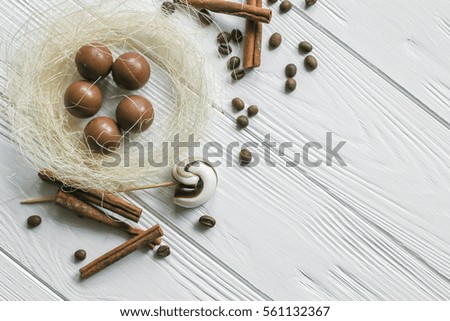 Set of coffee beans and chocolate sweets. White wooden background. Space for text