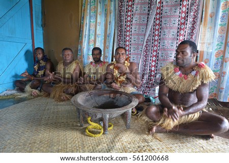 Indigenous Fijians men participate in traditional Kava Ceremony in Fiji. The consumption of the drink is a form of welcome and figures in important socio-political events.Real people. Copy space Royalty-Free Stock Photo #561200668