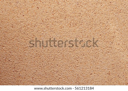 Beige wall texture with colored dots, background texture