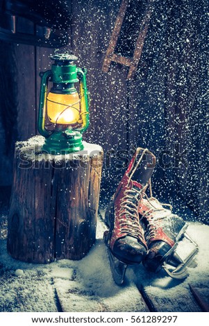 Cozy winter hut with skates and wax