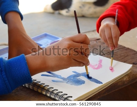 kids drawing on paper