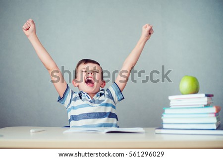 the student raised his hands for joy Royalty-Free Stock Photo #561296029