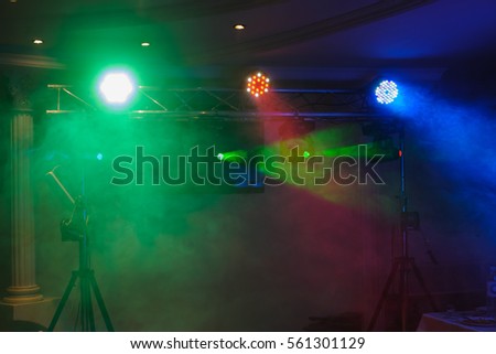 Disco lights and show. Concept about entertainment and party. Balloons and smoke