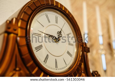 Antique wooden vintage wall clock isolated on backgroun