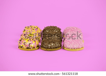 3 rows marshmallow biscuits with different flavors on pink