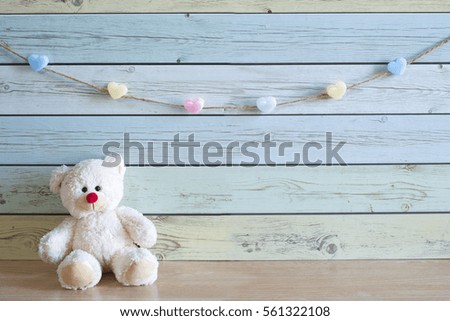 Teddy bear with toys , background wood pastel color