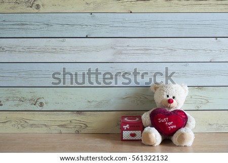 Teddy bear with toys , background wood pastel color